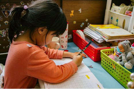 A child exploring a creative activity
